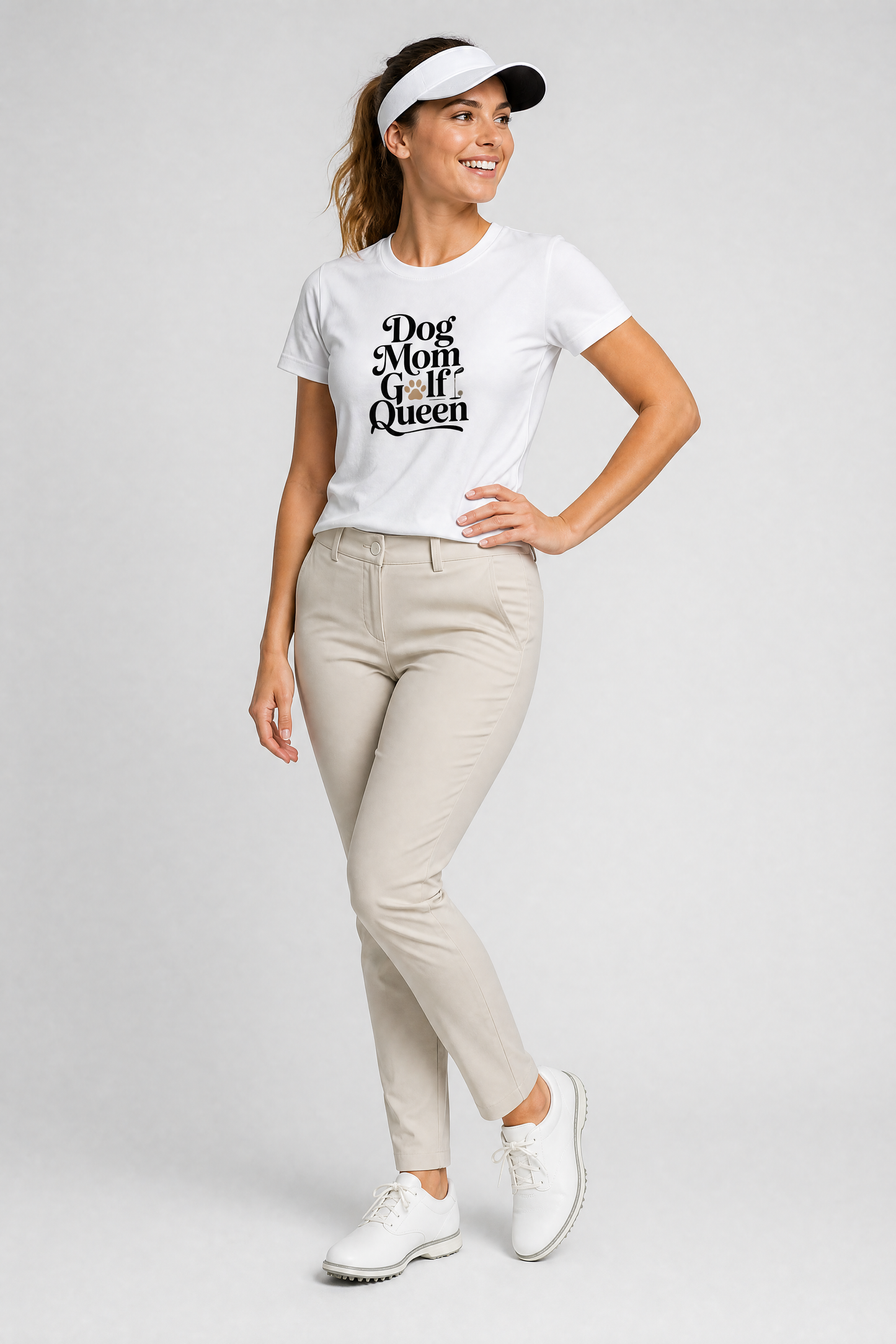 Woman wearing a white t-shirt with text, beige pants, and white sneakers on a light gray background