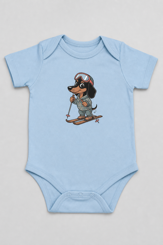 Pink baby bodysuit with cute skiing dachshund print, snap closure