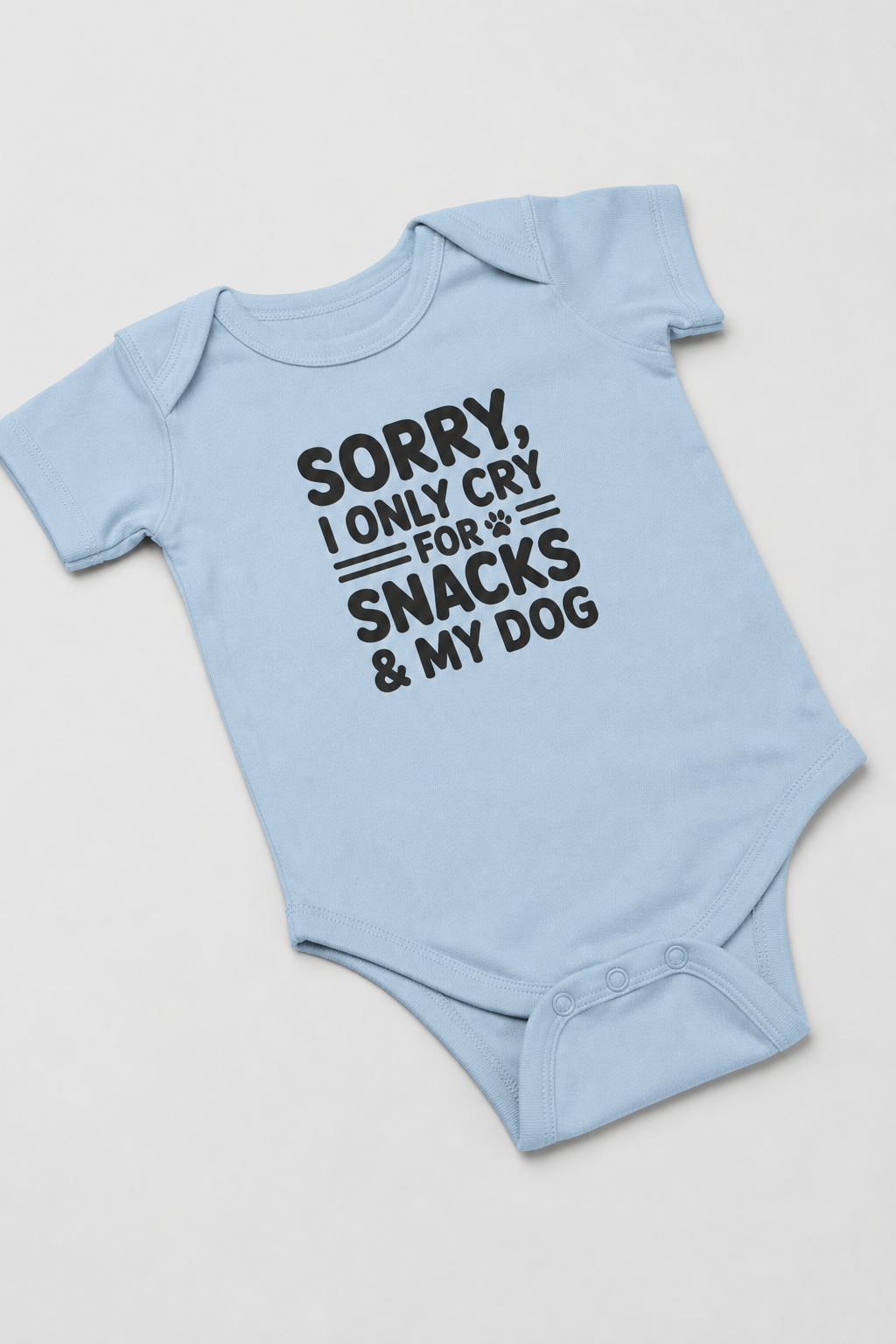 Baby wearing white Sorry I Only Cry For Snacks bodysuit, snap closure