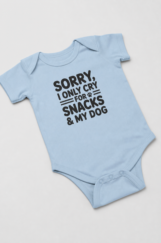 Baby wearing white Sorry I Only Cry For Snacks bodysuit, snap closure