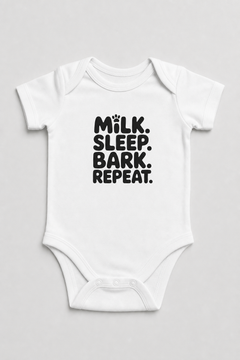 Pink baby bodysuit with Milk Sleep Bark Repeat dog print, snap closure