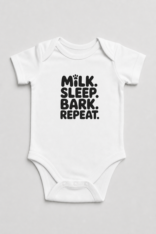Pink baby bodysuit with Milk Sleep Bark Repeat dog print, snap closure