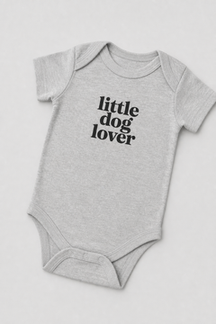 Baby wearing white Little Dog Lover bodysuit, snap closure