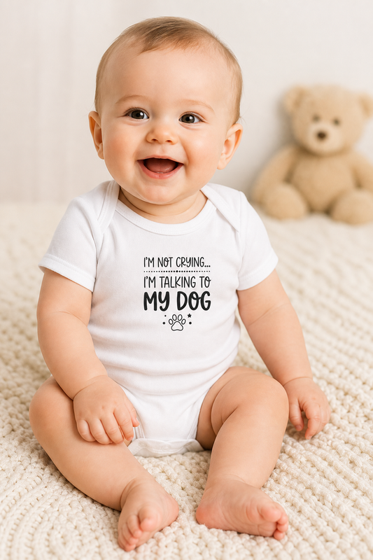 White baby bodysuit with I'm Not Crying I'm Talking to My Dog print, snap closure
