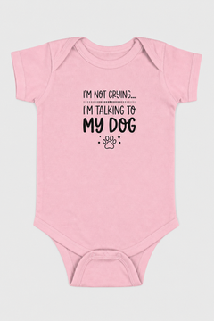 Pink baby bodysuit with I'm Not Crying I'm Talking to My Dog print, snap closure