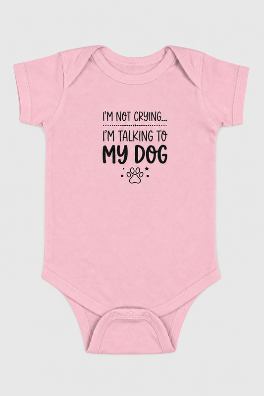 Pink baby bodysuit with I'm Not Crying I'm Talking to My Dog print, snap closure