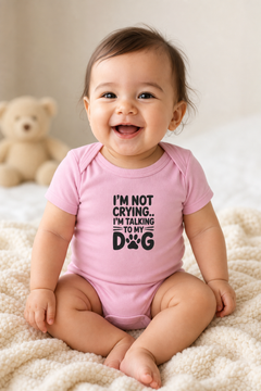 White baby bodysuit with I'm Not Crying I'm Talking to My Dog print, snap closure