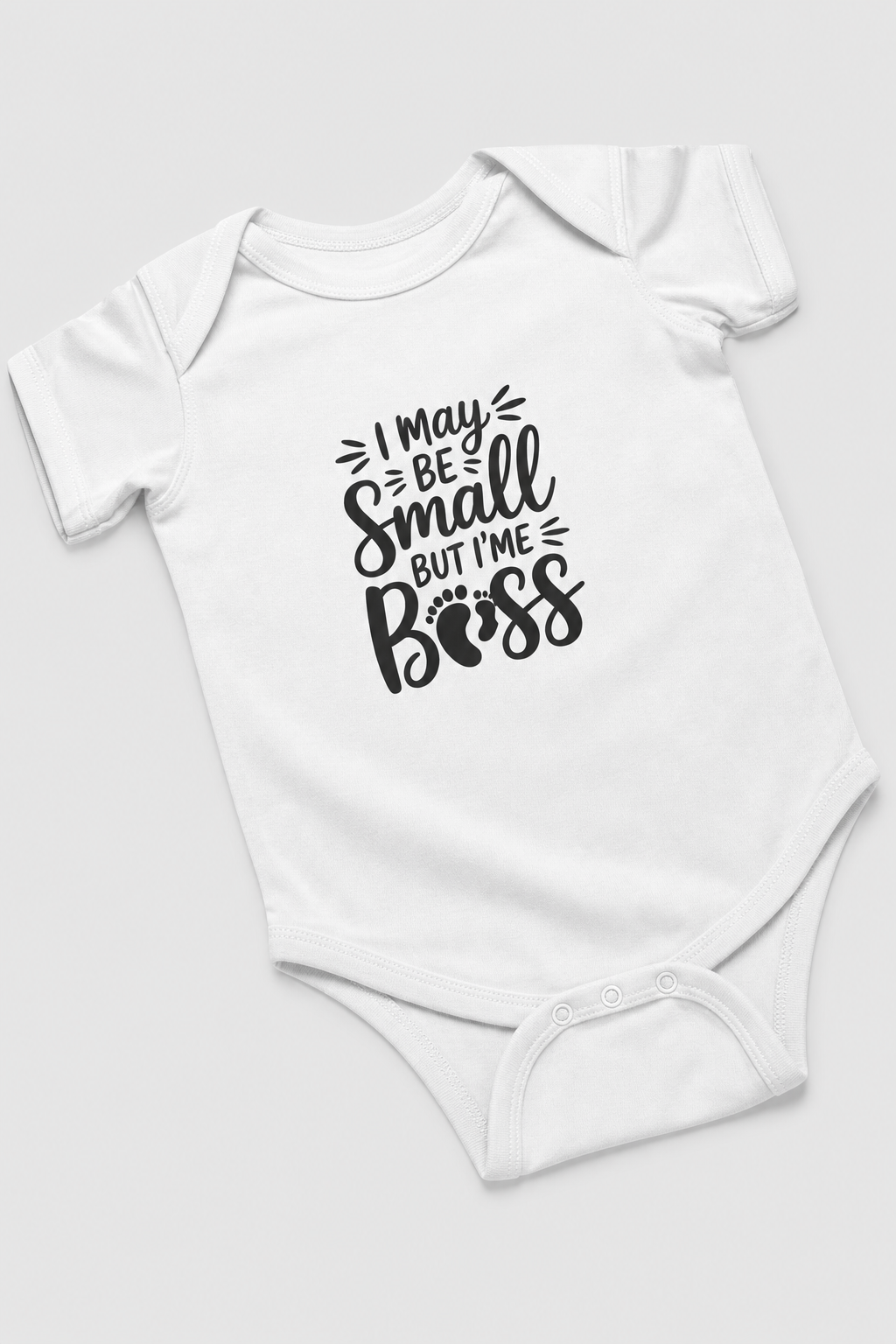 Baby wearing white I May Be Small But I'm Boss bodysuit, snap closure