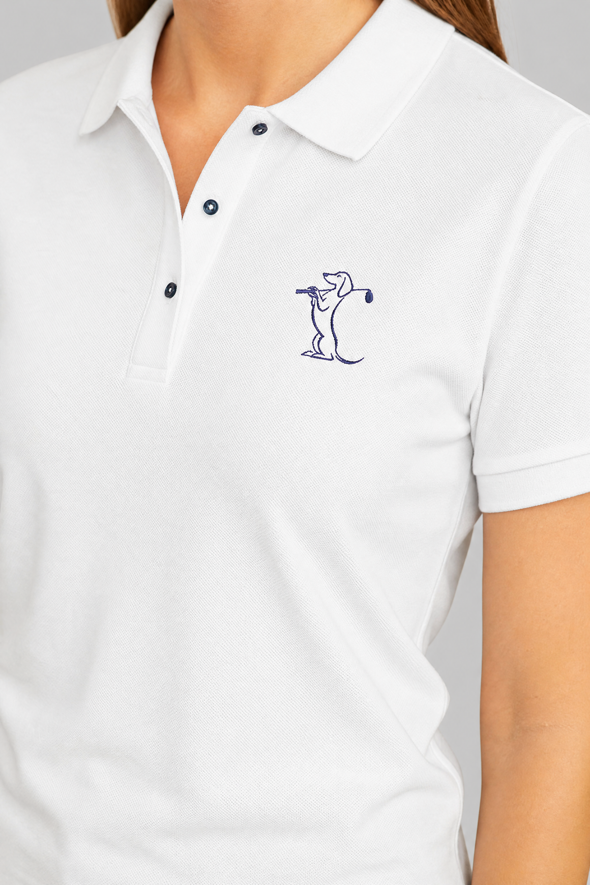 Embroidered golfer dog design stitched on a unisex golf polo shirt