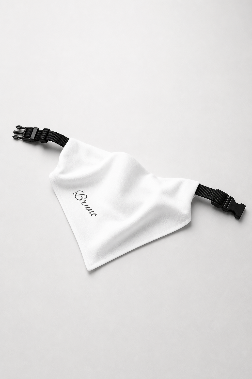 Dachshund wearing white personalized dog bandana with custom name