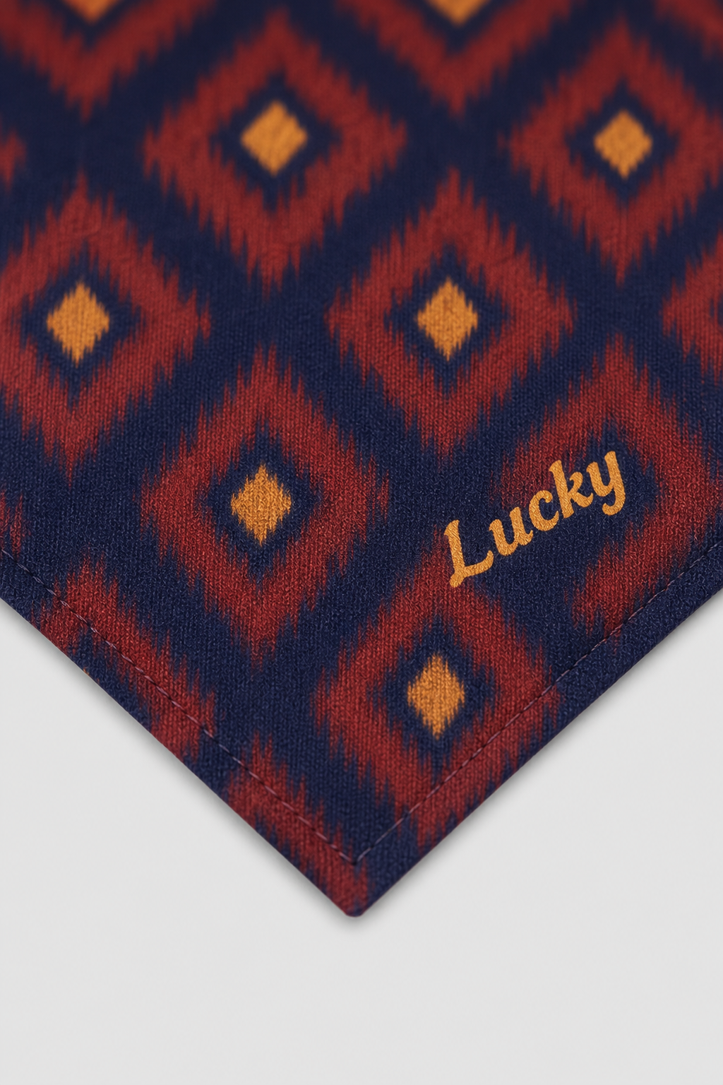 Beagle wearing red navy diamond pattern personalized dog bandana