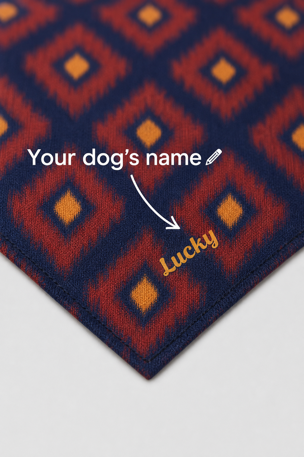Diamond pattern custom name detail on red navy dog bandana