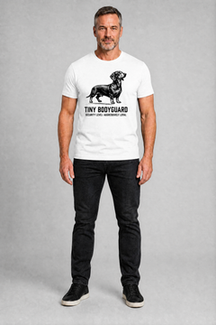 Man wearing a white t-shirt with a dachshund graphic and text on a gray background