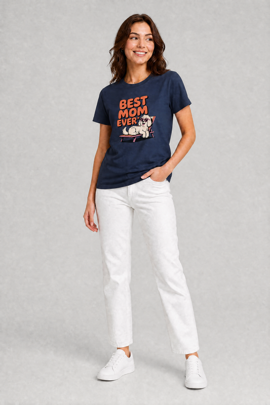 Woman wearing a navy t-shirt with 'Best Mom Ever' text and a dog graphic, paired with white pants on a gray background.