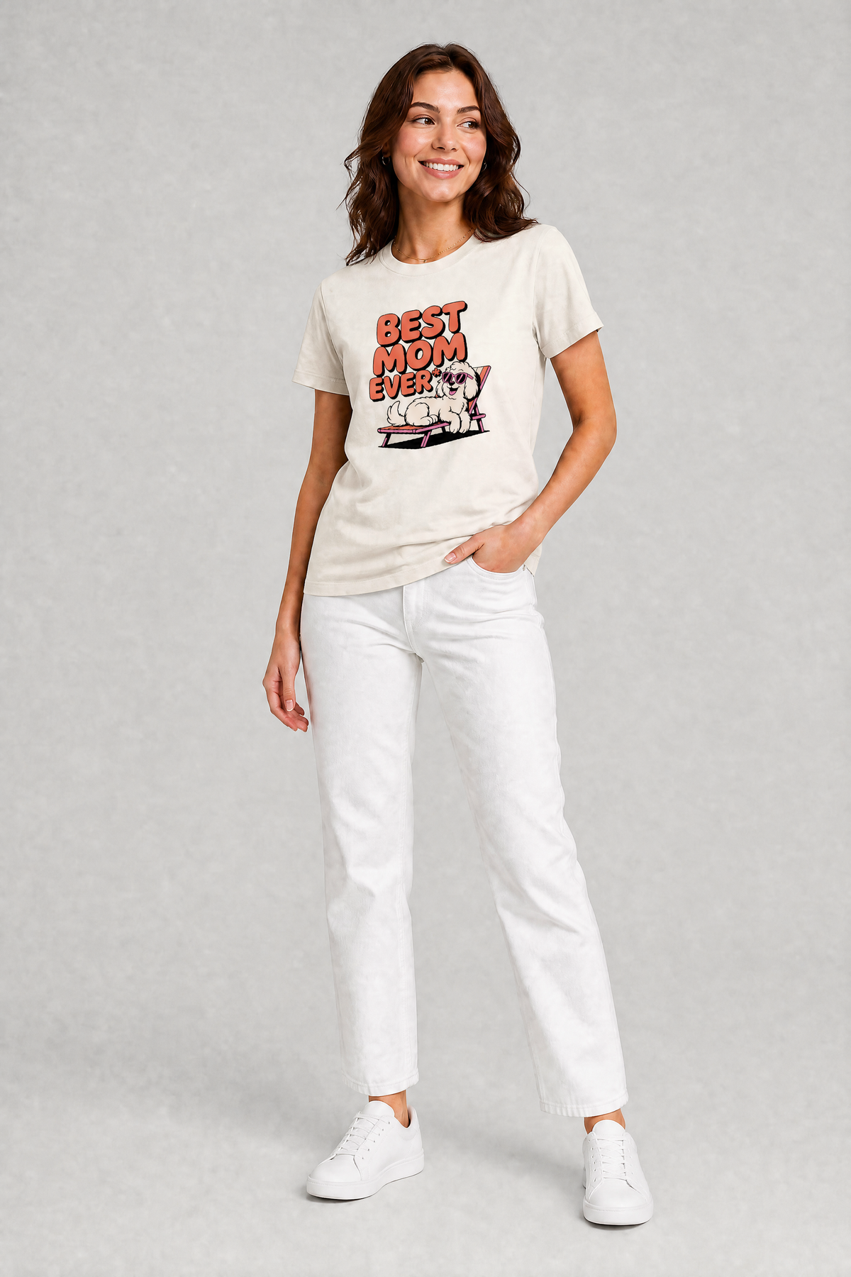 Woman wearing a white t-shirt with text and graphics, standing against a plain background