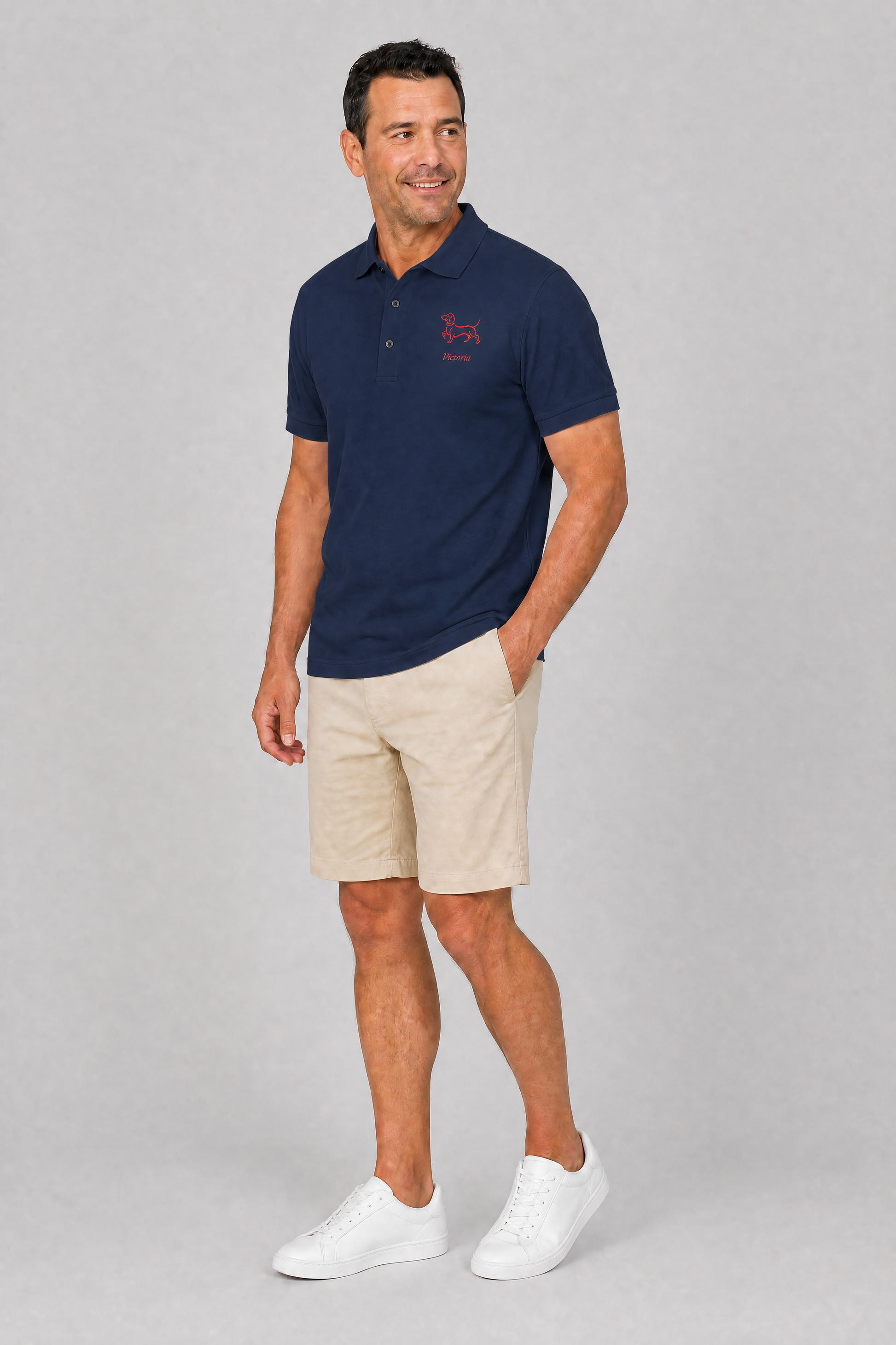 Stone embroidered dachshund polo shirt with personalized dog name, flat lay