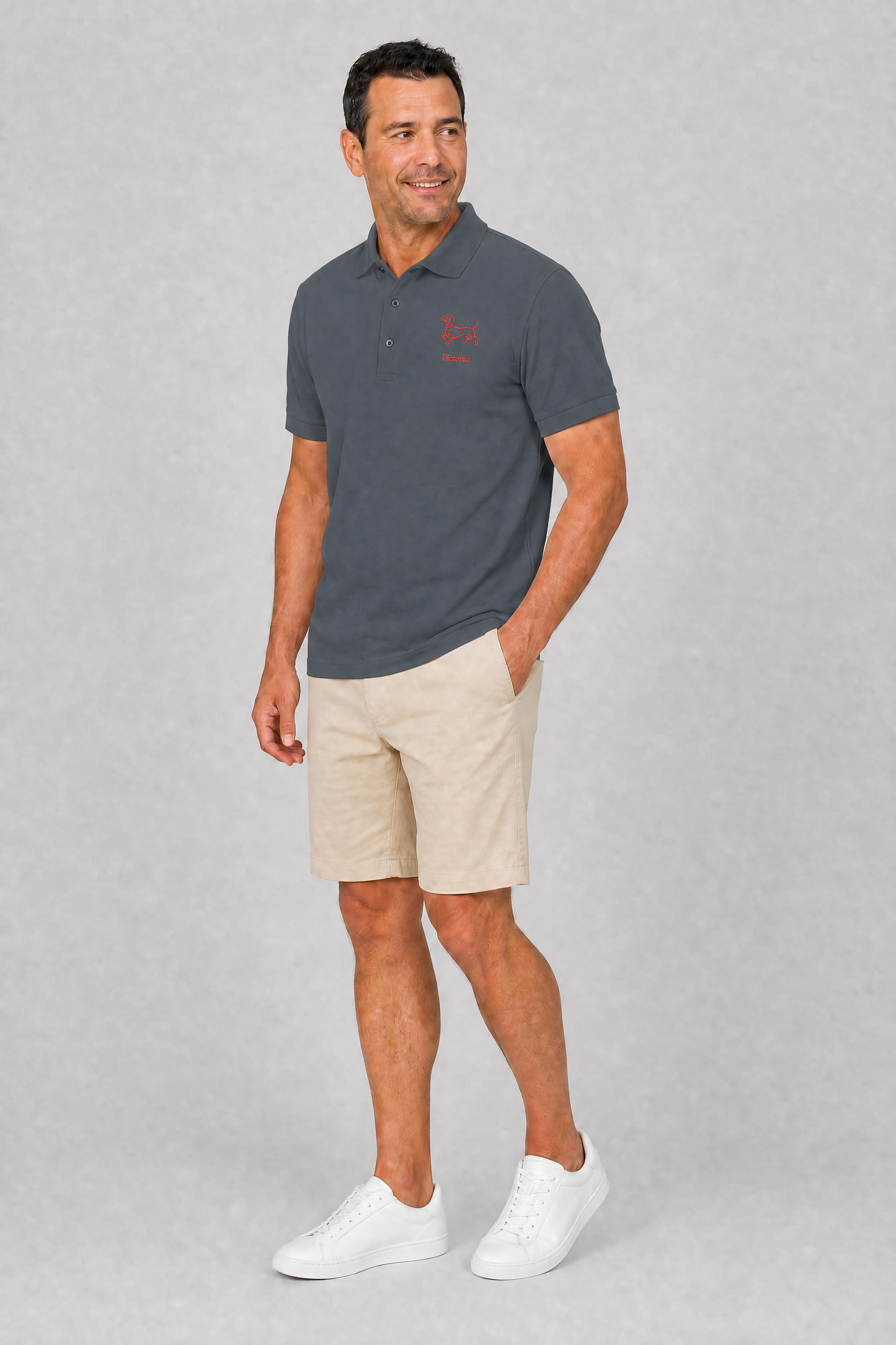 Cool grey embroidered dachshund polo shirt with personalized dog name, flat lay