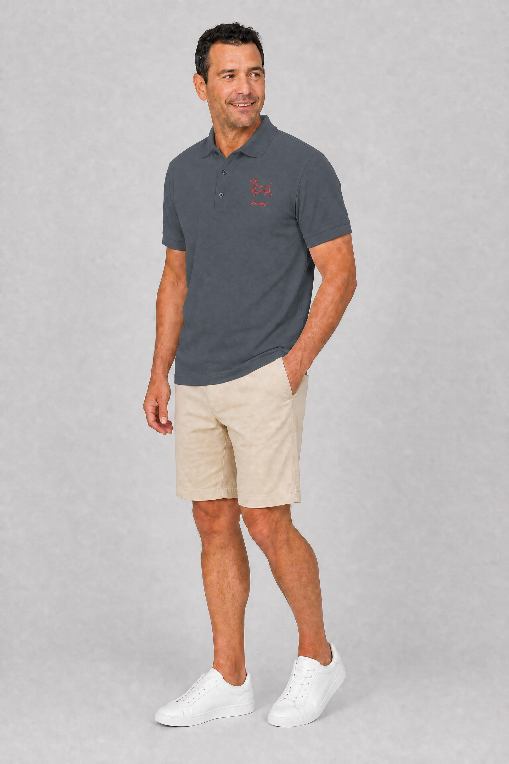 Cool grey embroidered dachshund polo shirt with personalized dog name, flat lay