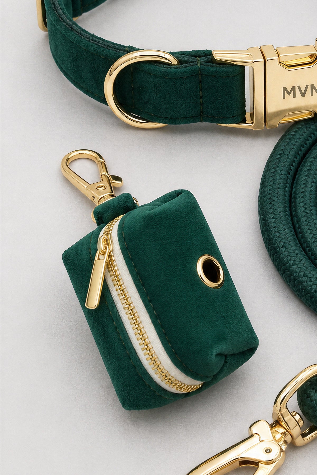 Deep green velvet poop bag holder with gold zipper from the MVM Evergreen set, detail