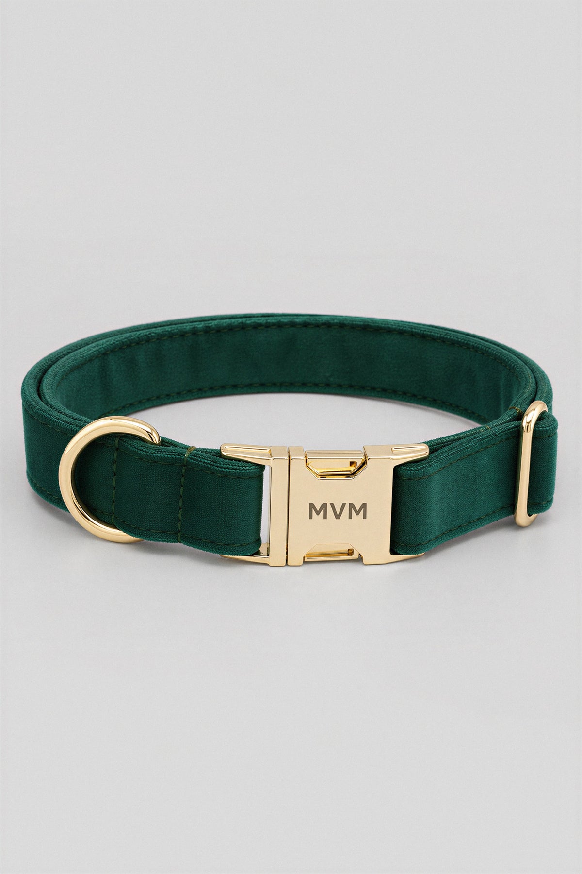 Deep green velvet MVM Evergreen dog collar with engraved gold MVM buckle, detail