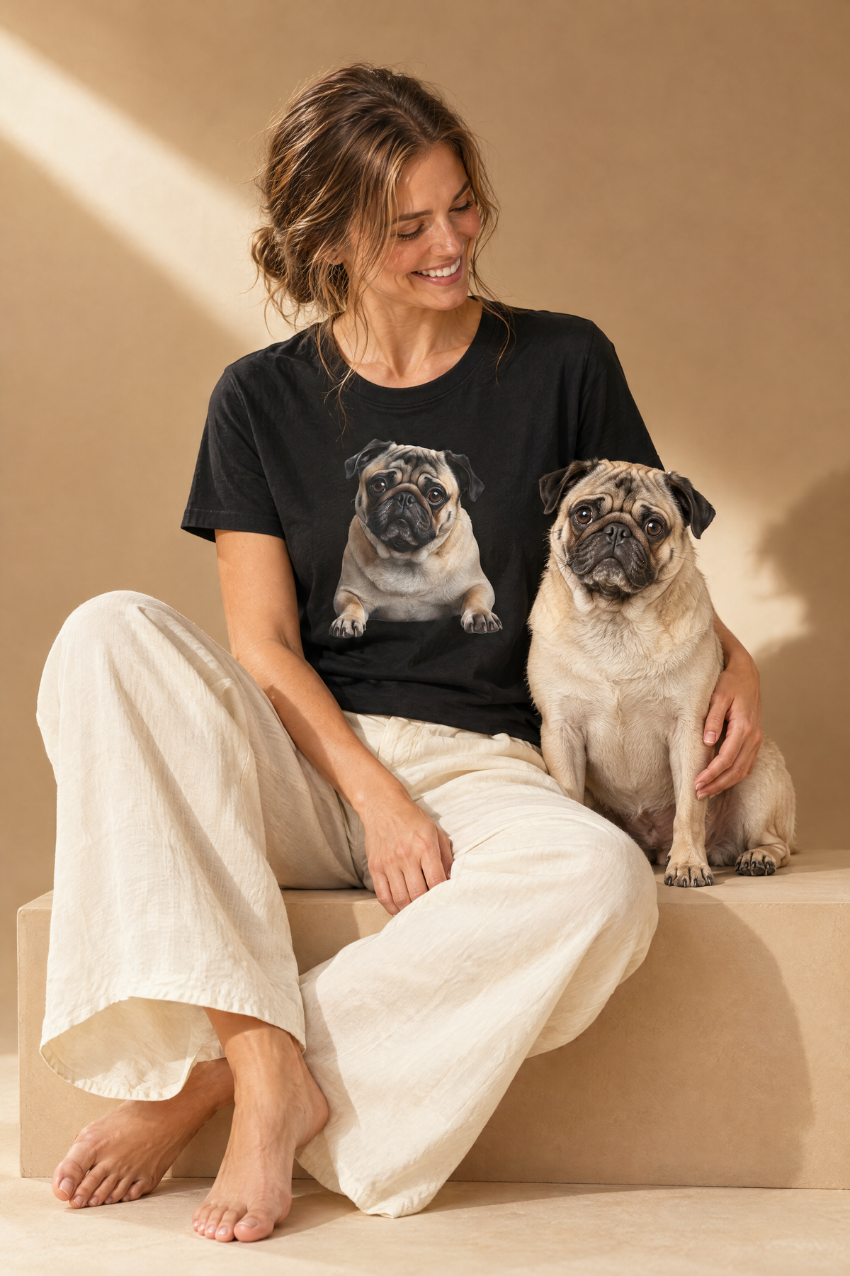 Woman in the black Pug Portrait t-shirt sitting with her pug