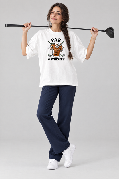 Woman holding a driver behind her shoulders in the white Par & Whiskey Dachshund Golf Tee and navy trousers. Color: White