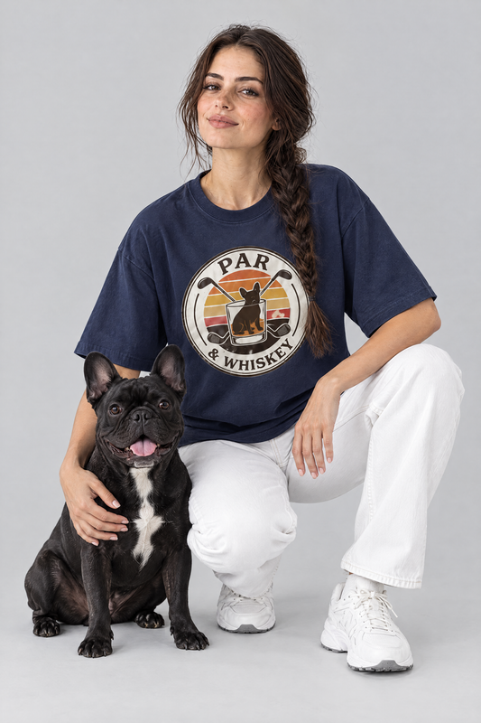 Woman crouching with a black French bulldog in the navy Par & Whiskey French Bulldog Badge Golf Tee. Color: Navy