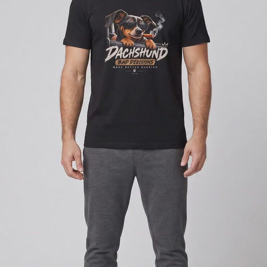 Video of the black Dachshund Bad Decisions Make Better Stories t-shirt worn by a man, camera moving in on the print