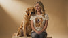 Woman wearing a personalized dog-themed t-shirt featuring a custom dog portrait in a lifestyle setting.