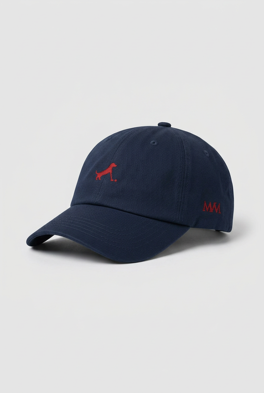 Color: Navy. Golf cap, angled side view with burgundy Putting dachshund and MVM monogram