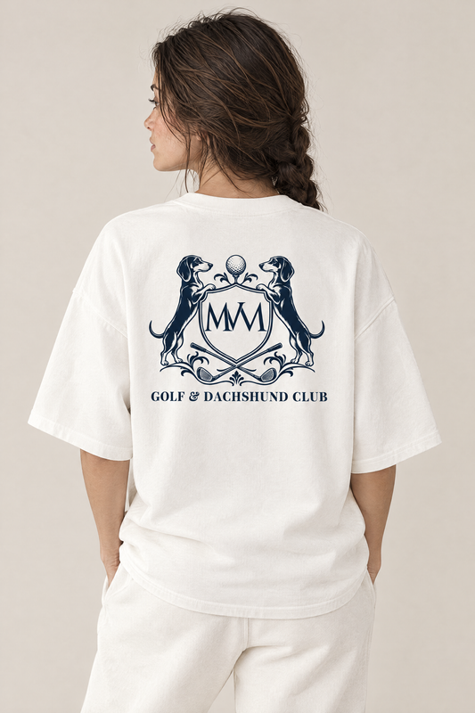 Back view of the white Club Crest tee with the large navy Golf & Dachshund Club crest across the upper back