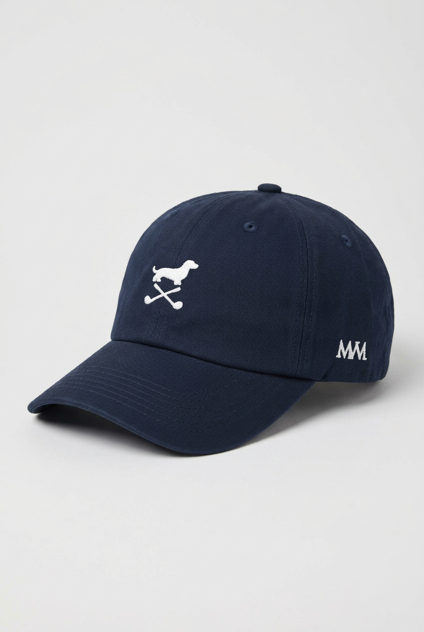 Color: Navy. Golf cap, angled side view with white Club Mark dachshund and MVM monogram