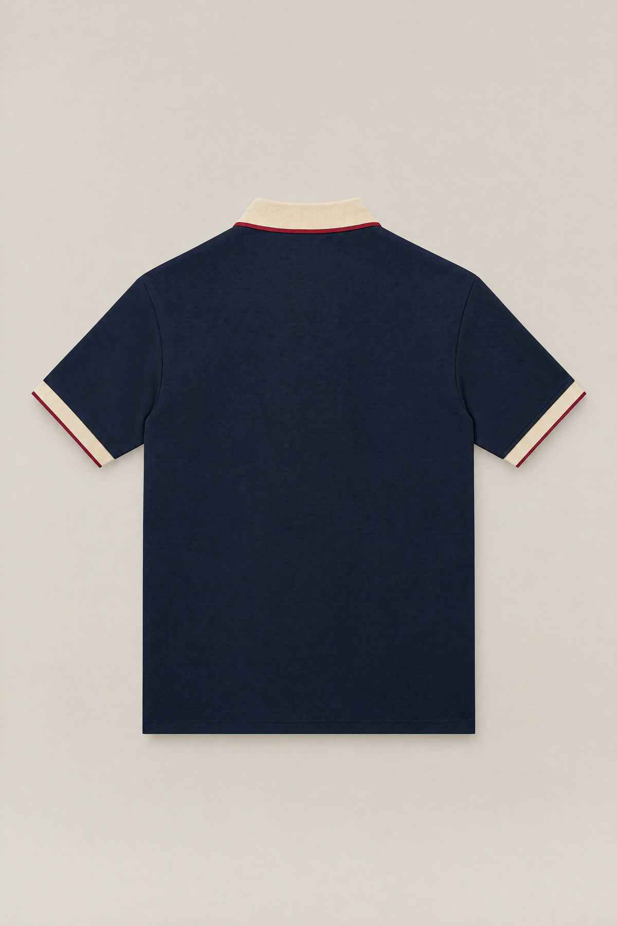 Club Crest color block polo in navy with apricot collar and cuffs, back view packshot. Color: Navy Blue with Apricot