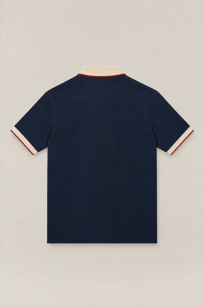 Club Crest color block polo in navy with apricot collar and cuffs, back view packshot. Color: Navy Blue with Apricot