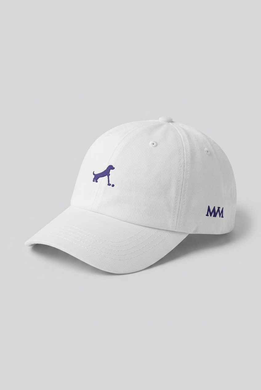 Color: White. Golf cap, angled side view with navy Putting dachshund and MVM monogram