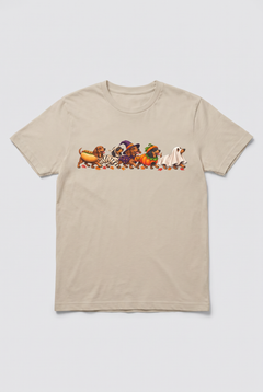 Flat lay of a sand wiener dog Halloween parade t-shirt with five dachshunds dressed as hot dog, mummy, witch, pumpkin and ghost