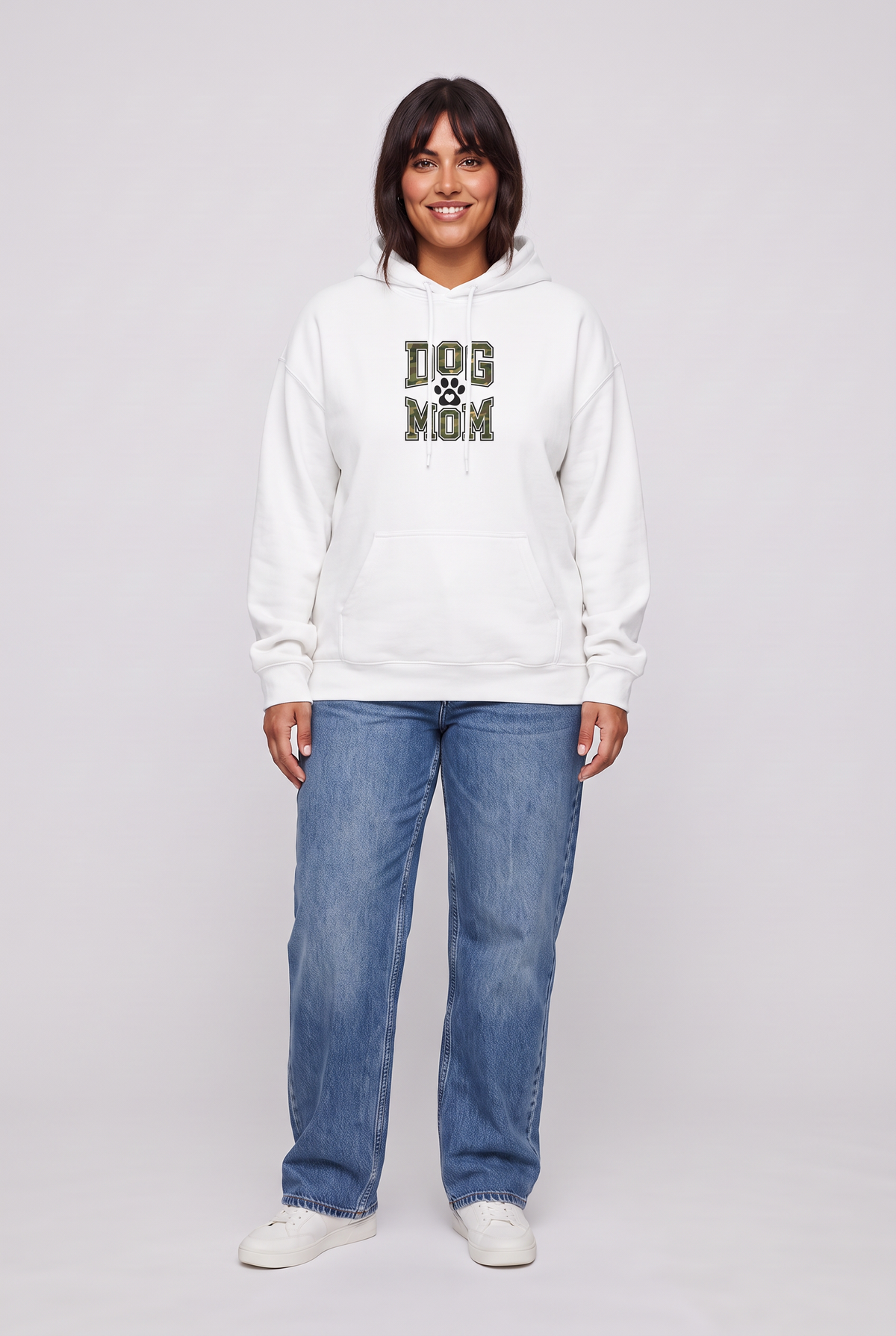 Woman wearing the Camo Dog Mom hoodie in white, front view. Color: White