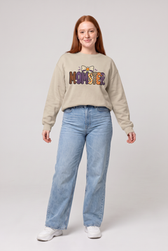 Woman wearing the Momster Halloween sweatshirt in sand, front view. Color: Sand