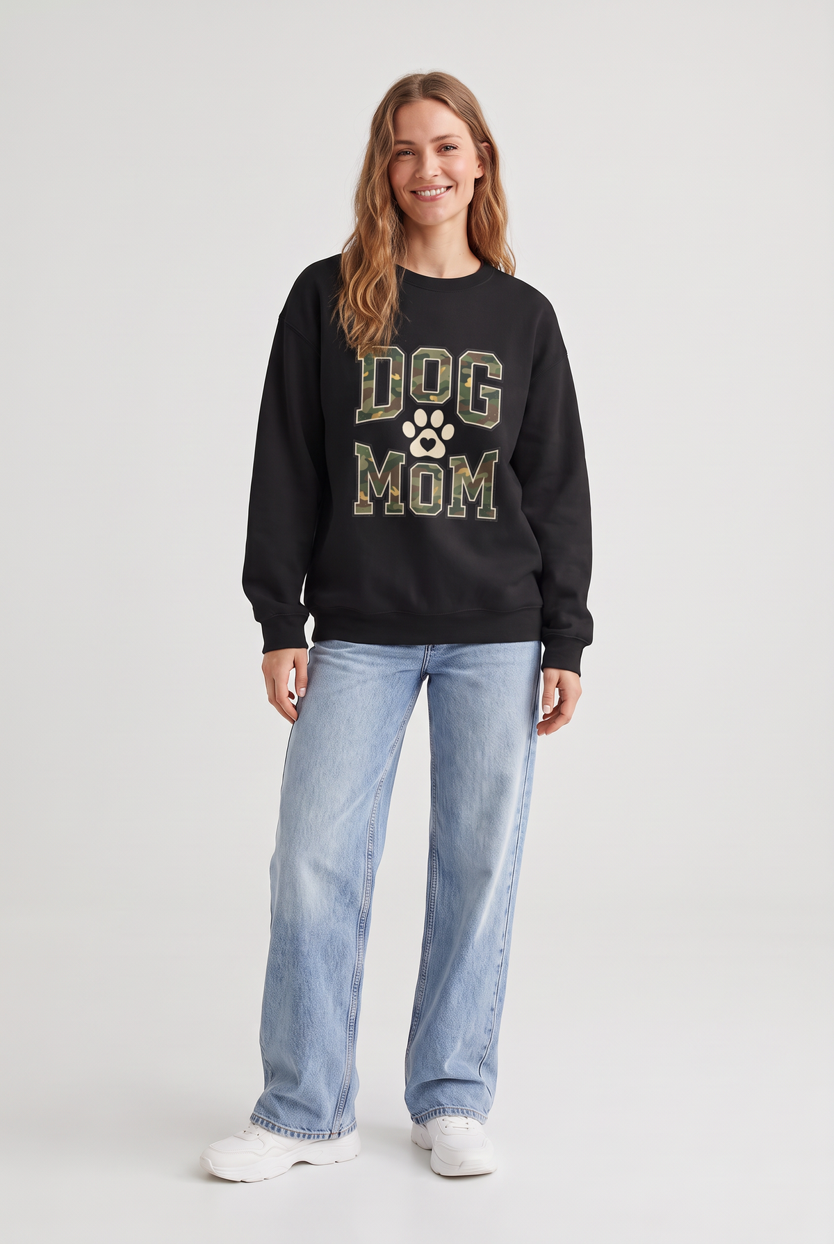 Woman wearing the Camo Dog Mom sweatshirt in black, front view. Color: Black