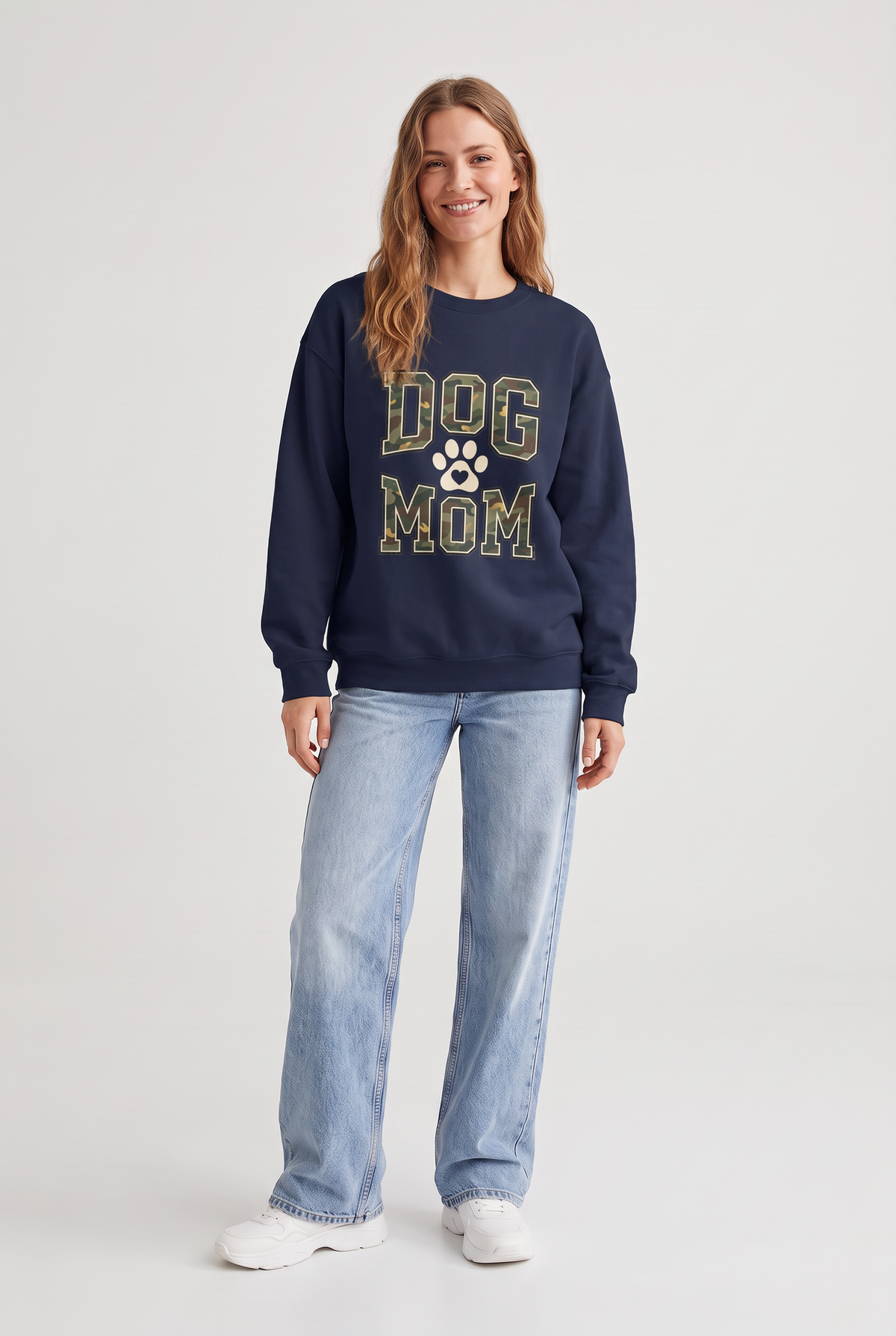 Woman wearing the Camo Dog Mom sweatshirt in navy, front view. Color: Navy