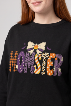 Close-up of the print on the Momster Halloween sweatshirt in black. Color: Black