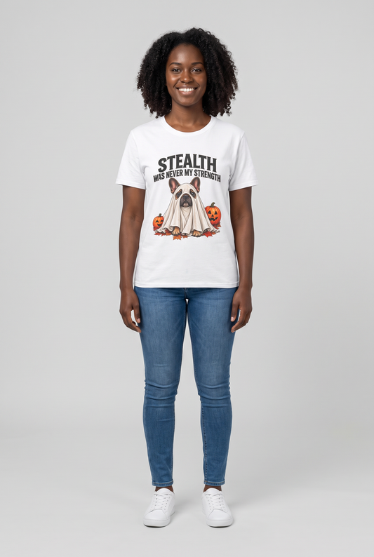 Woman wearing a white French bulldog Halloween t-shirt with a Frenchie ghost and the text Stealth Was Never My Strength, front view