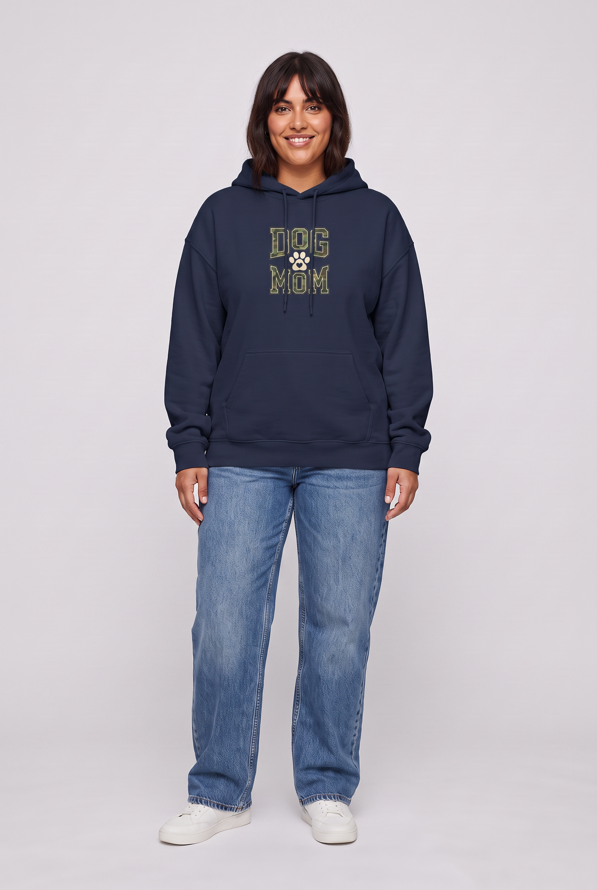 Woman wearing the Camo Dog Mom hoodie in navy, front view. Color: Navy