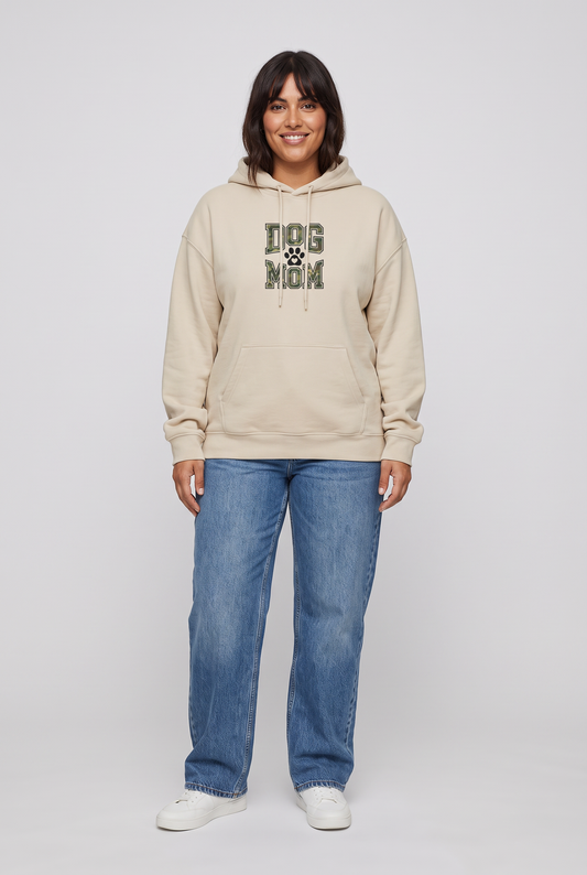 Woman wearing the Camo Dog Mom hoodie in sand, front view. Color: Sand