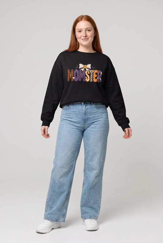 Woman wearing the Momster Halloween sweatshirt in black, front view. Color: Black