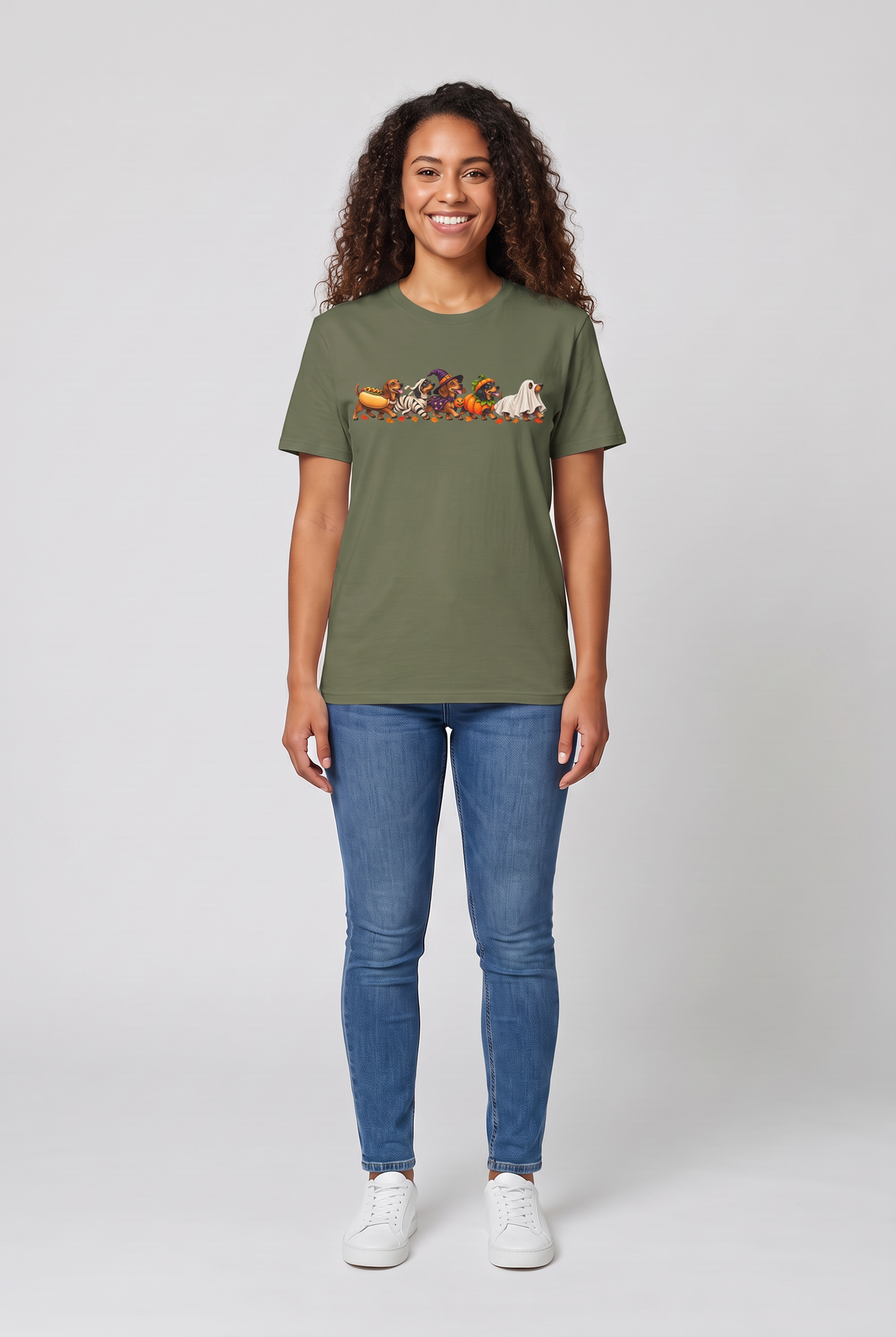 Woman wearing a military green wiener dog Halloween parade t-shirt with five dachshunds dressed as hot dog, mummy, witch, pumpkin and ghost, front view