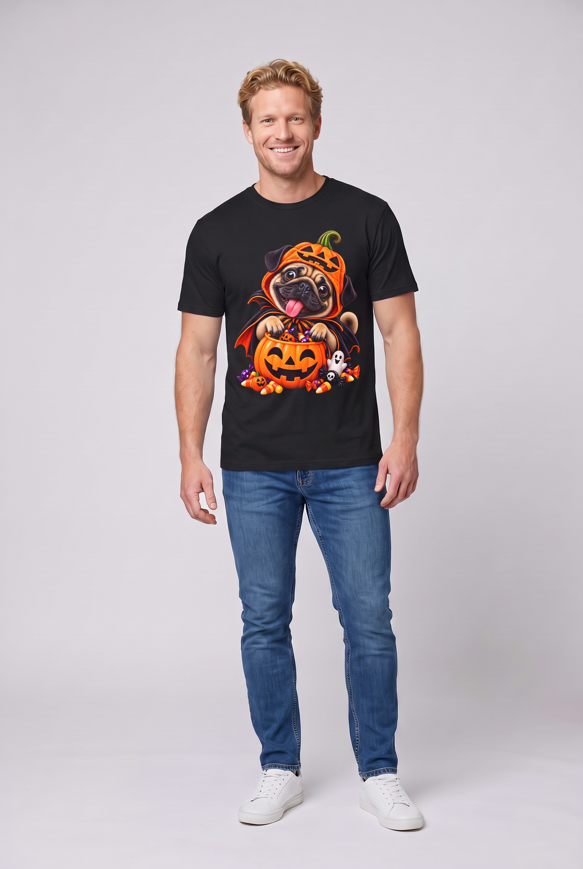 Man wearing a black pug Halloween t-shirt with a pug in a pumpkin costume and candy bucket, front view