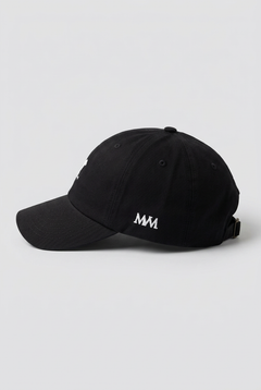 Color: Black. Golf cap, angled side view with white Swing dachshund and MVM monogram