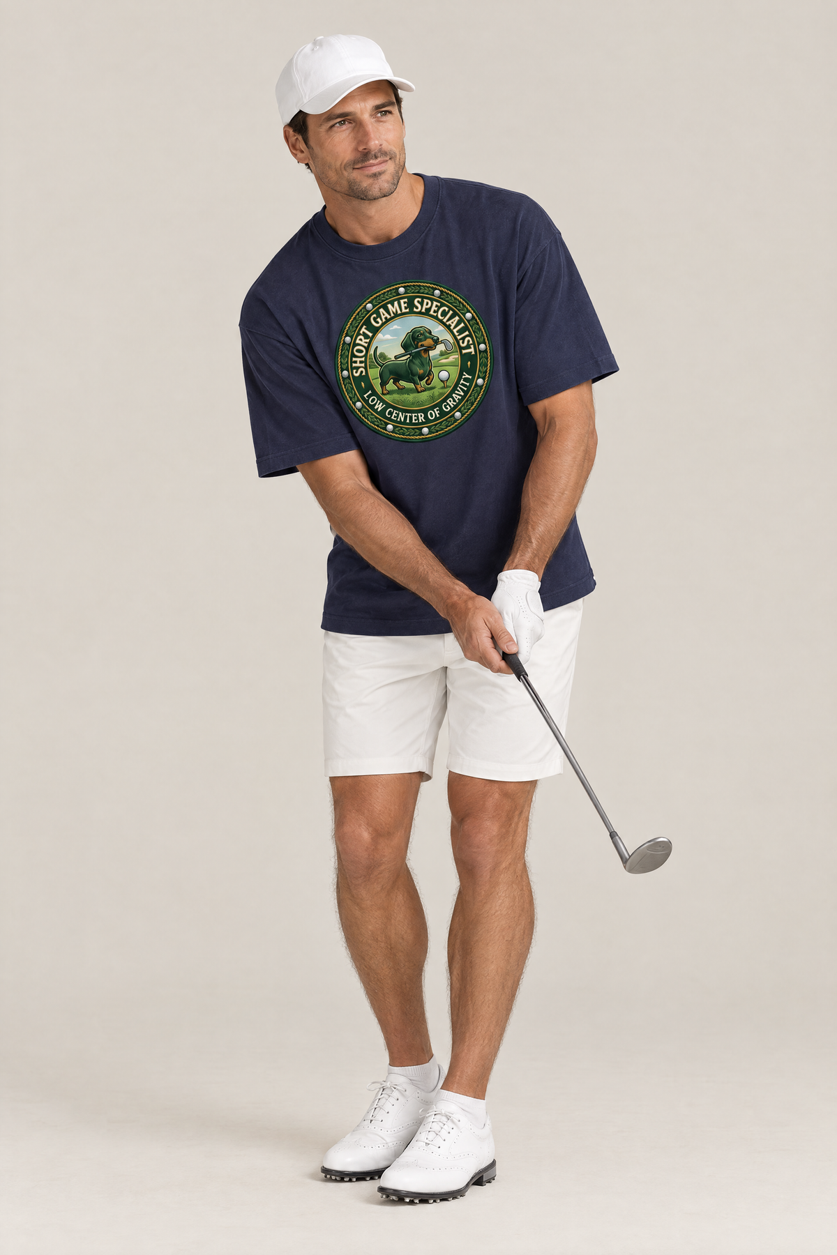 Man playing a chip shot in the navy Short Game Crest Dachshund Golf Tee. Color: Navy