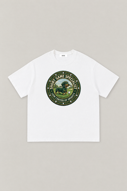 Short Game Crest Dachshund Golf Tee in white, flat lay front view. Color: White